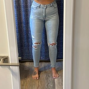 AE Super Hi Rise light wash distressed jegging
